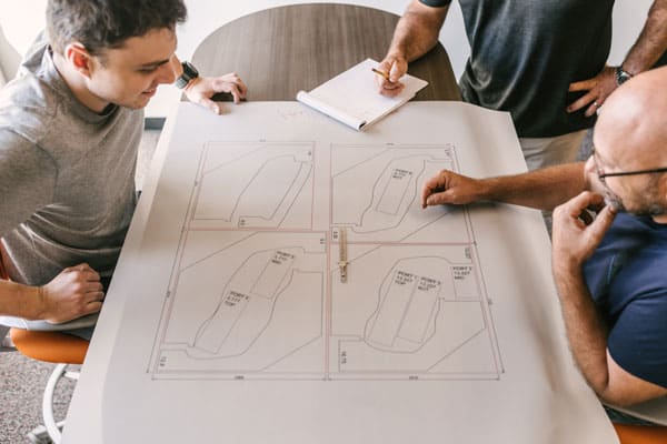 Team discussing composite drawings